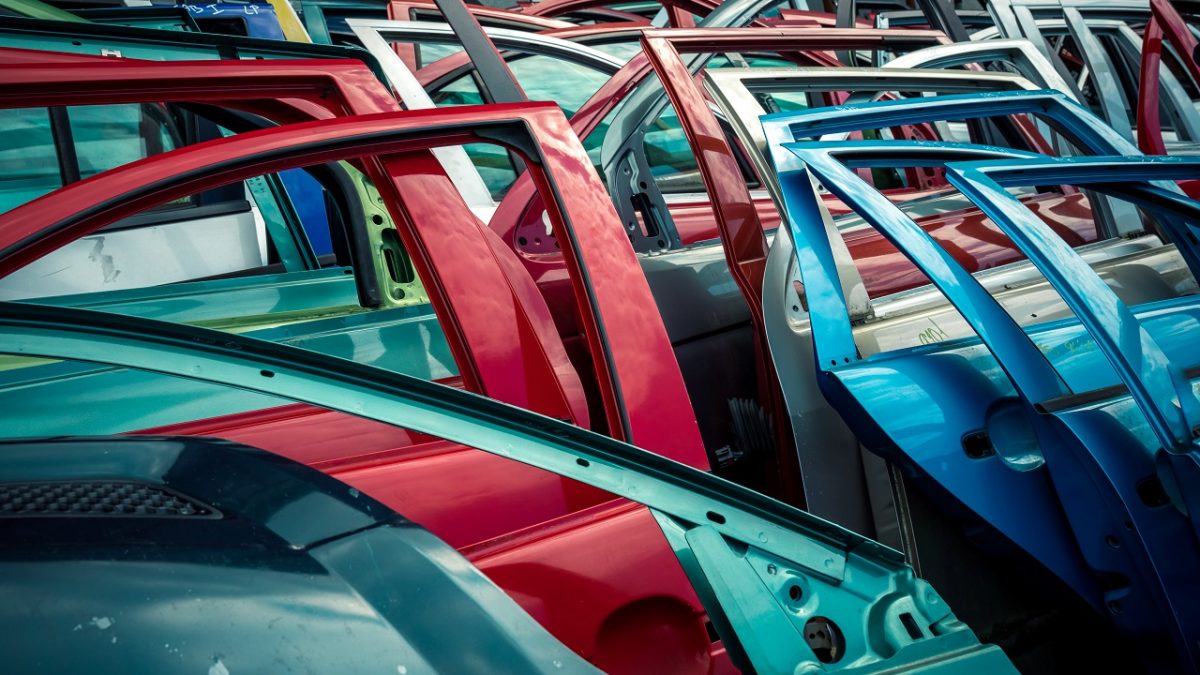 car doors of different colors at a car junkyard