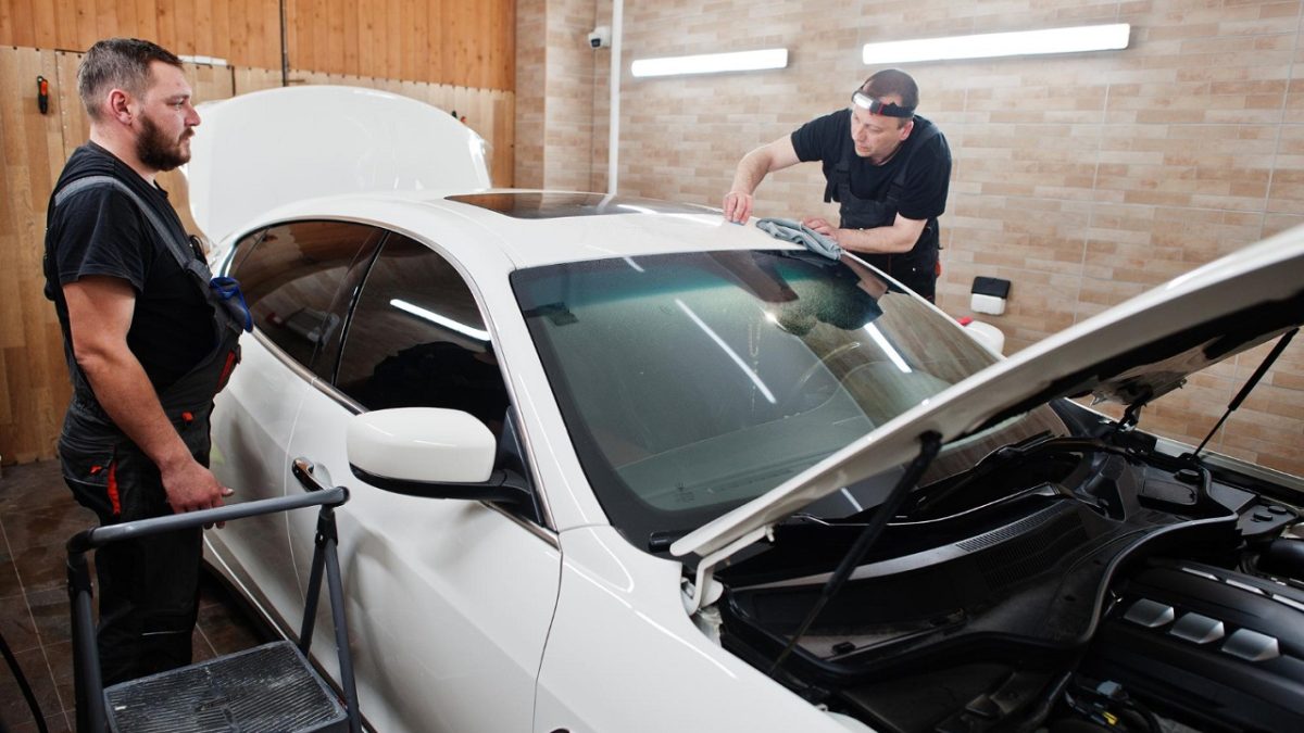 repairing a car in the garage