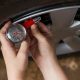 using the tire pressure gauge of the tire emergency kit to check the tires