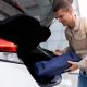 man with his emergency car kit
