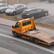 orange flatbed tow truck