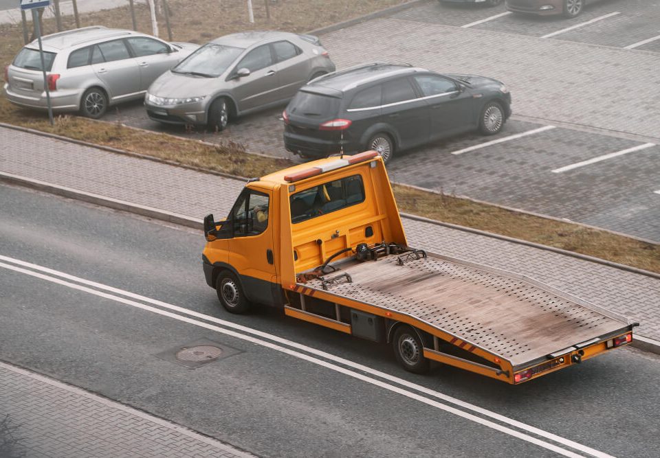 orange flatbed tow truck