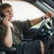 woman waiting for roadside assistance inside her car